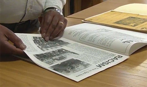 Photo: Close up of hand turning study resources page