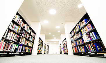 Photo: Books on shelves in the Ahmed Iqbal Ullah RACE Centre