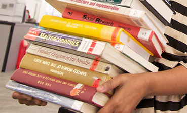 Person holding books