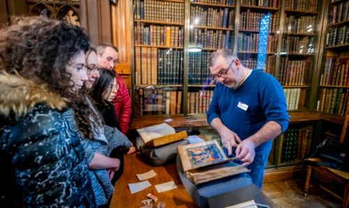 Visitors to the Rylands are shown an item from Special Collections