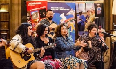 Musicians performing as part of Migrant Voices Takeover event