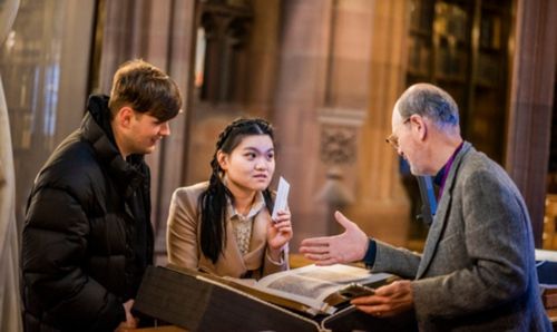 Visitors to the Rylands in conversation in the Historic Reading Room.