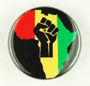 Black badge with multi-coloured design depicting black fist on map of Africa.