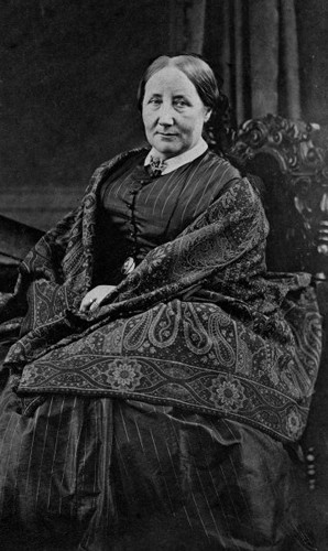 Black and white photograph of woman in Victorian clothing