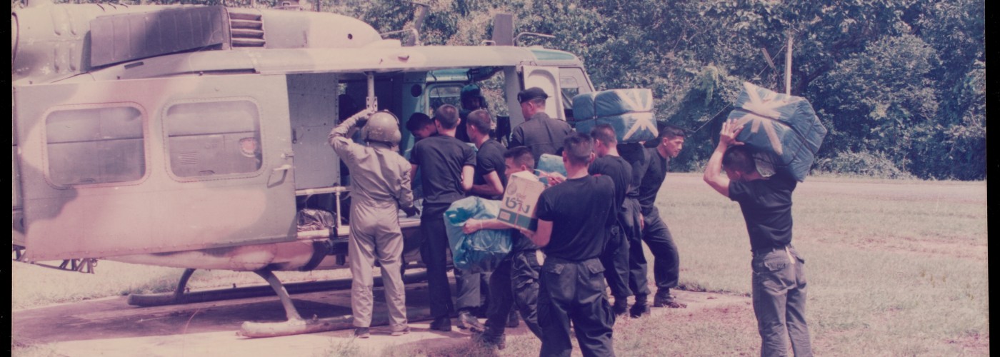 Aid workers loading boxes into a convoy vehicle