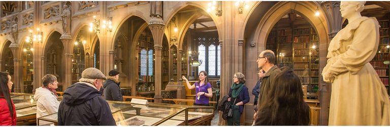 Rylands staff speaking to visitors in the Reading Room