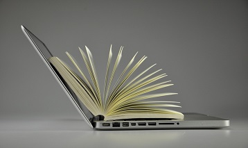 picture of open laptop and book inside