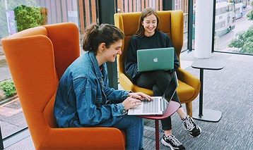 Two students using laptops