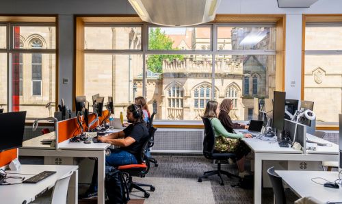 Students revising in the Library overlooking the Christie Building