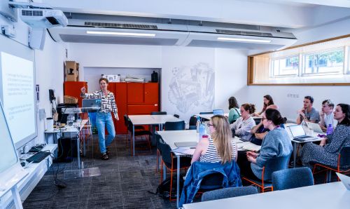 Library staff member hosting a workshop for students and researchers in AGLC training room