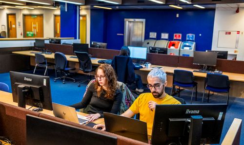 Two students working at computers