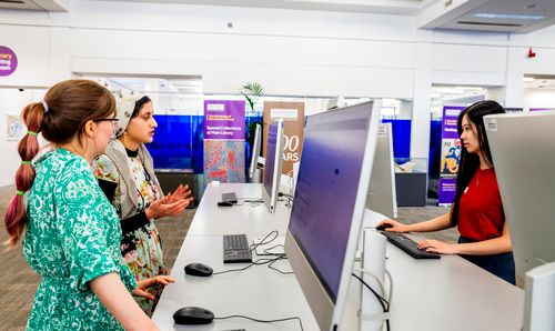Three students at computers