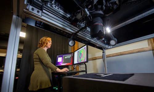 Woman photographs object